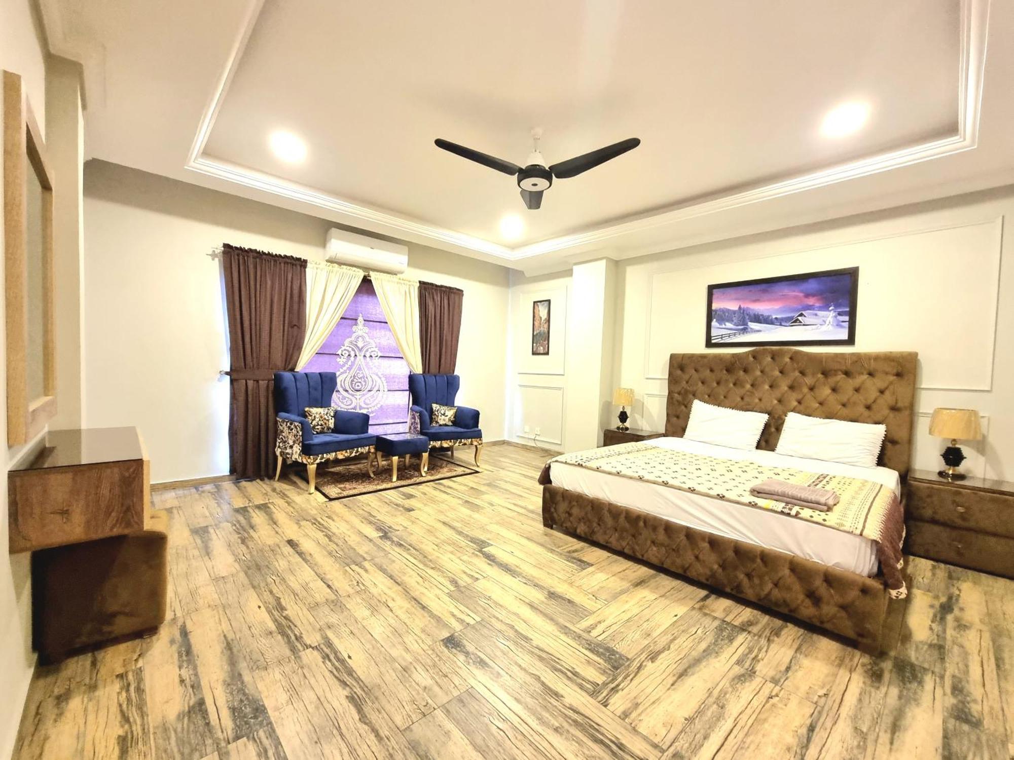 The Millenial Apartments & Suites Bahria Town Равалпінді Номер фото